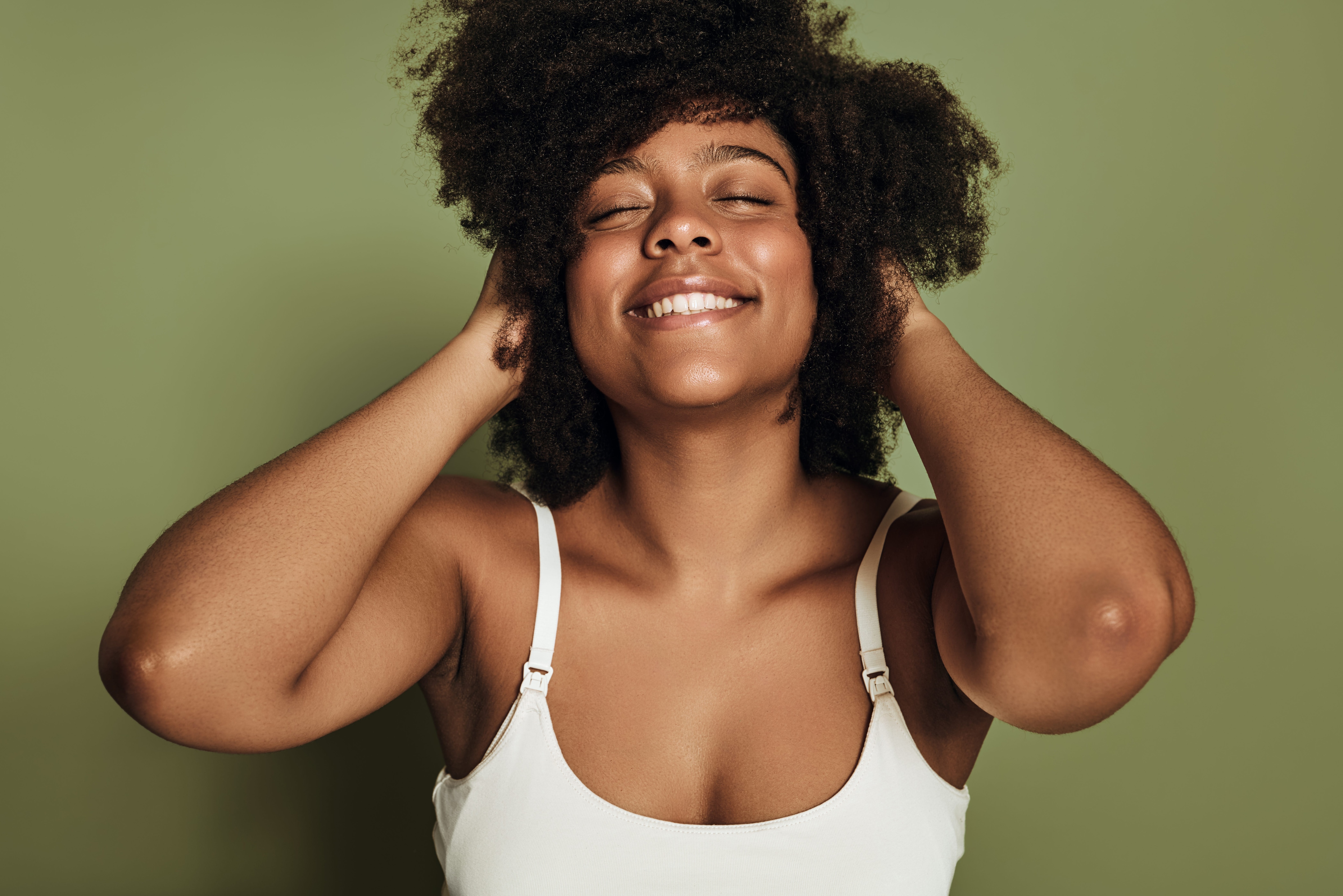 Black woman is happy because she’s wearing a comfortable soft bra
