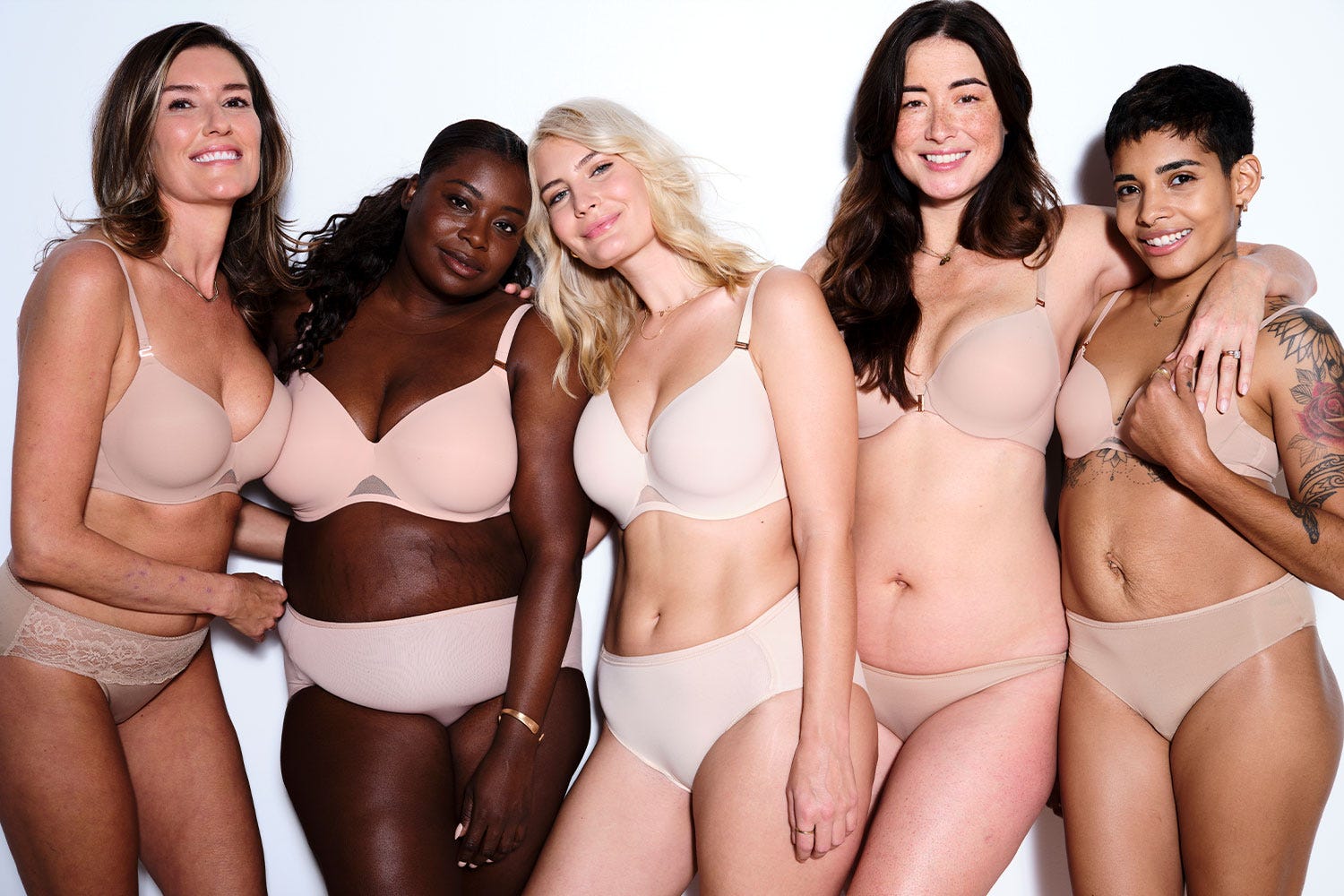 Soma® Women’s models wearing nude-colored Bodify™ bras and nude panties.